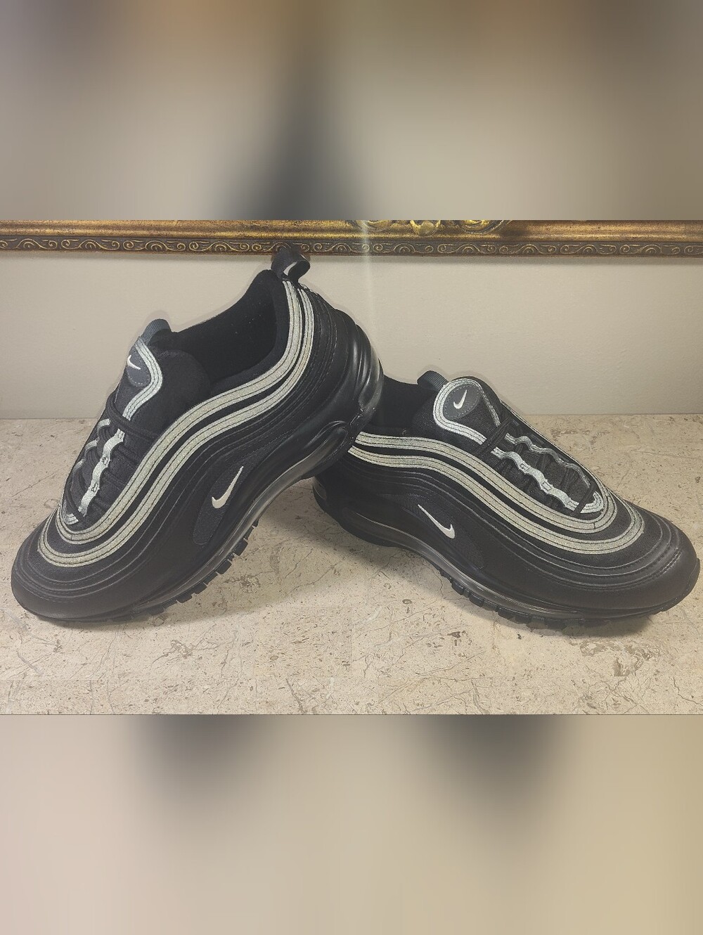 Nike Air Max 97 Big Kids Black Sneakers with Silver Reflective Stripes.